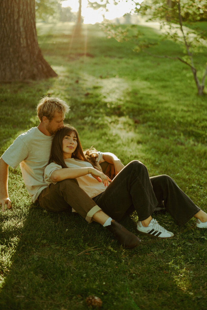 engaged couple poses softly for camera