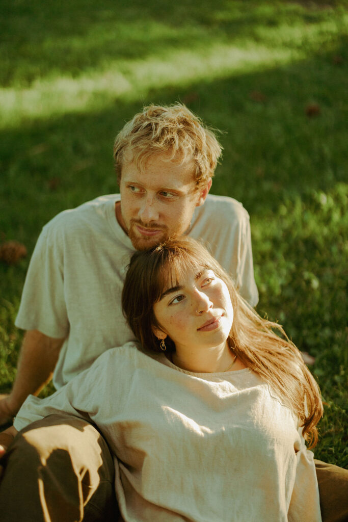 engaged couple poses softly for camera