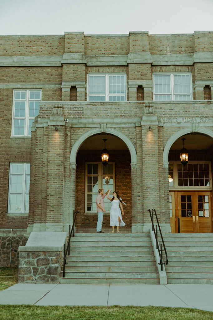 couple dancing for their engagement photos in bend oregon