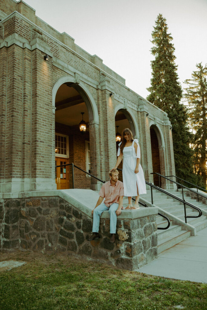 couple sitting for their engagement photos in bend oregon