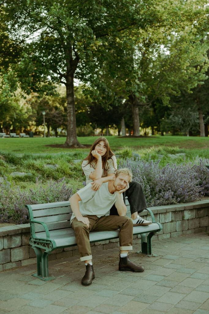 engaged couple poses stoicly for camera