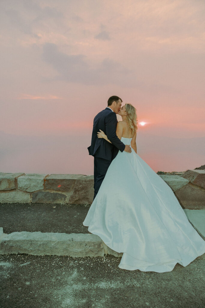 bride and groom kissing at destination elopement crater lake oregon