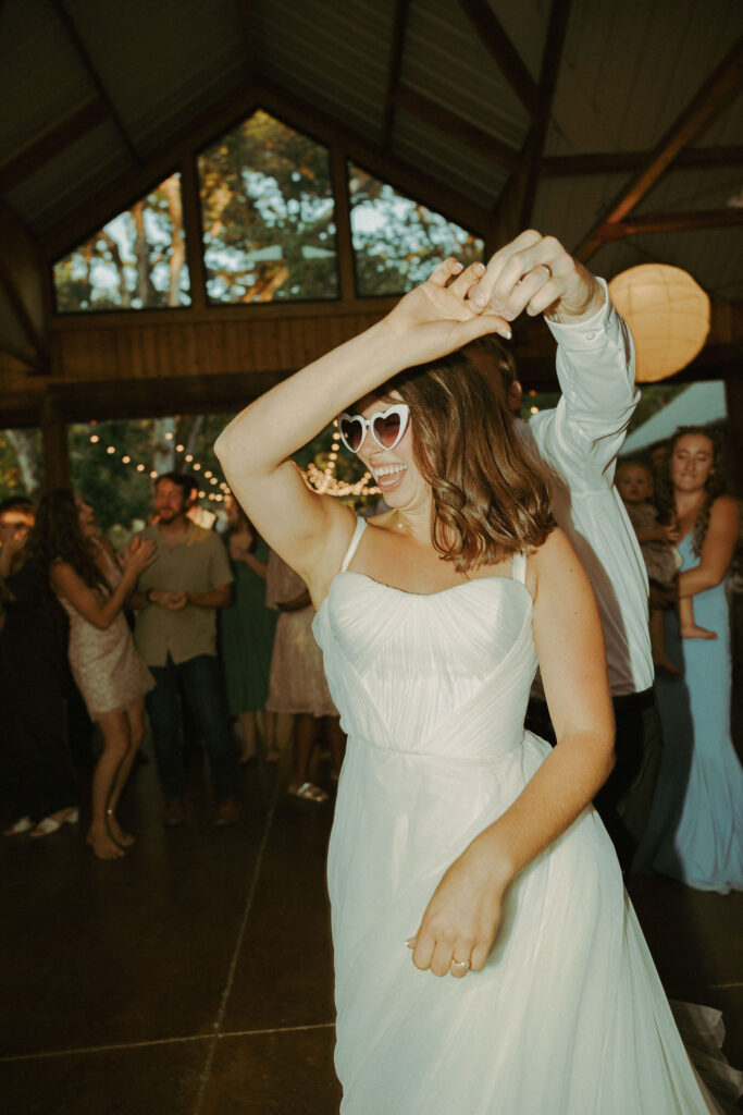 bride dancing at wedding in Mt Pisgah Arboretum in oregon