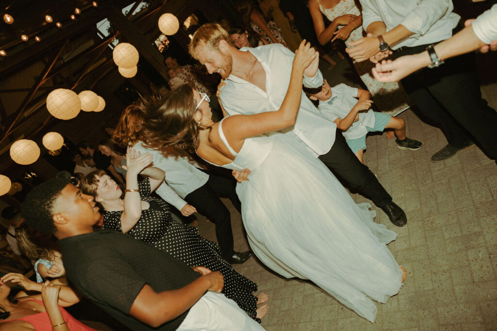 bride and groom dancing on dance floor at wedding reception