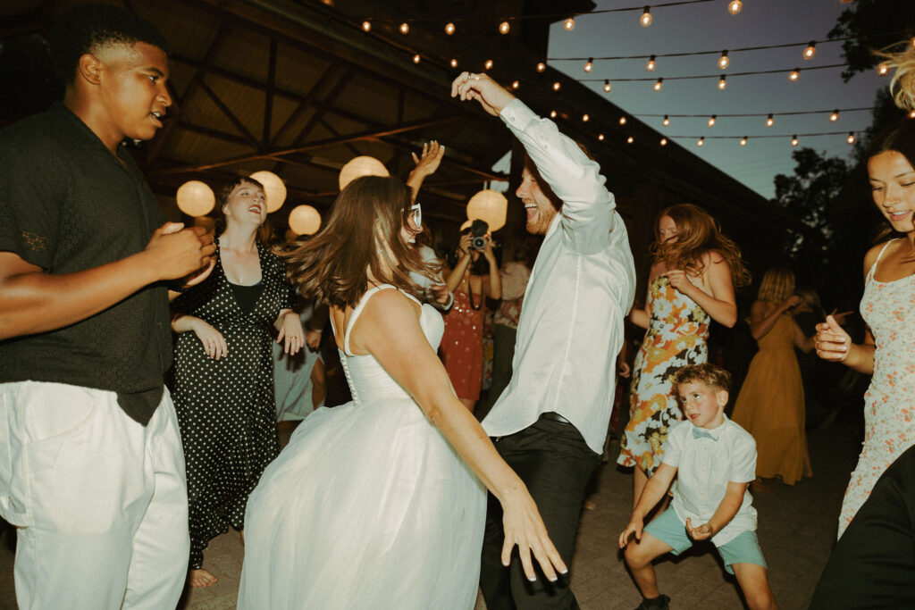 bride and groom dancing on dance floor at wedding reception