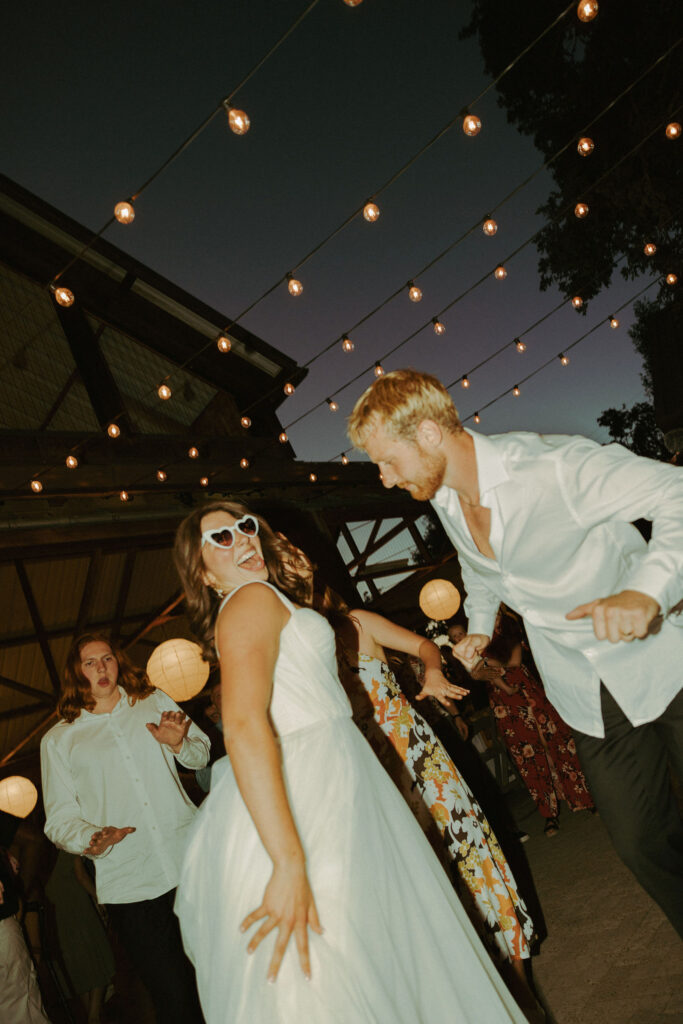 bride and groom dancing on dance floor at wedding reception