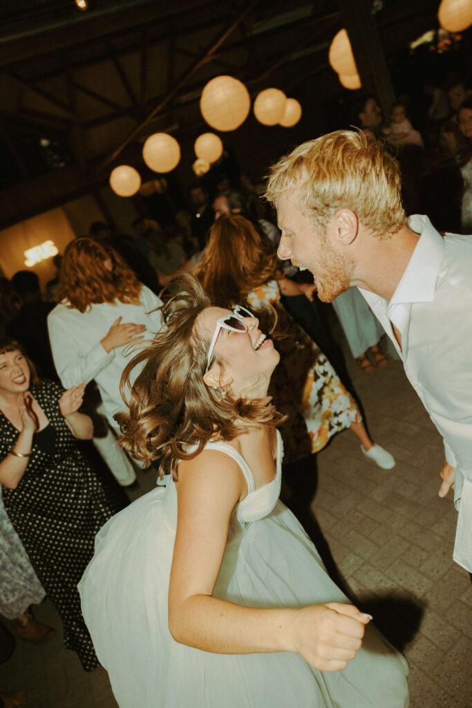 bride and groom dancing together at wedding at mt pisgah 