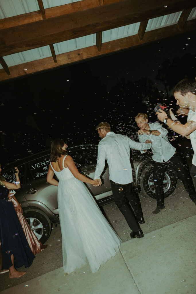 Bubble exit at wedding reception mt pisgah arboretum wedding in oregon